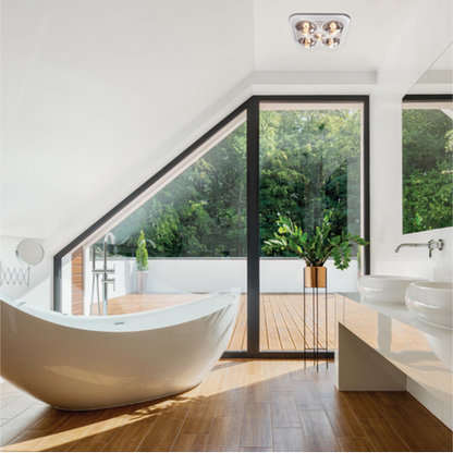 Modern bathroom with a freestanding bathtub, large windows, and a plant.