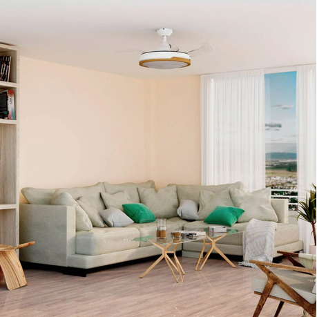 Modern living room with a sectional sofa, coffee table, and bookshelf.