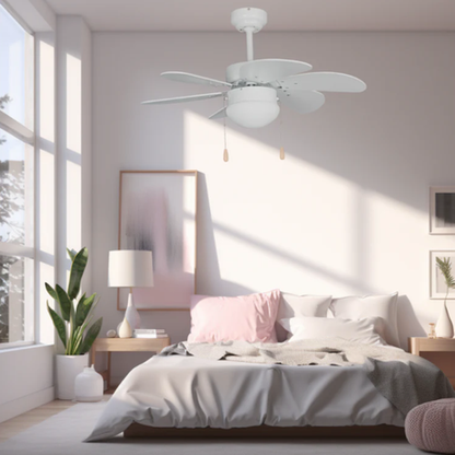 Modern bedroom with a ceiling fan, bed, and decorative elements.