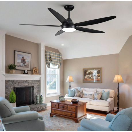 Living room with a ceiling fan, fireplace, and furniture.