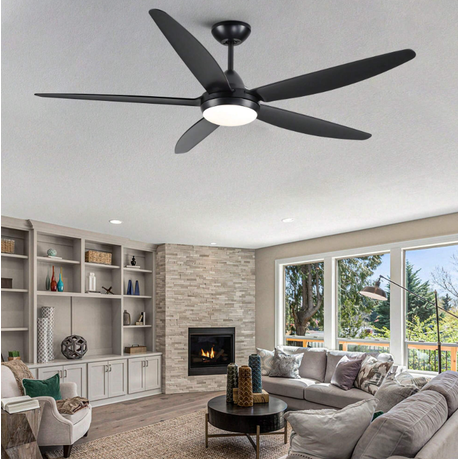 Ceiling fan in a living room with a fireplace and large windows.