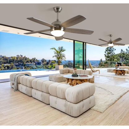 Modern living room with ceiling fans, large windows, and outdoor view.