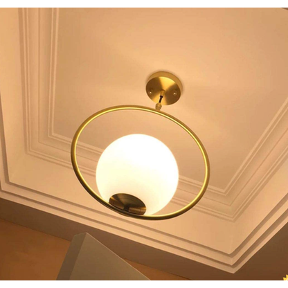 Gold modern pendant light with frosted glass shade, E27 fitting, warm ambient glow, ideal for kitchens, dining areas, and contemporary interiors.