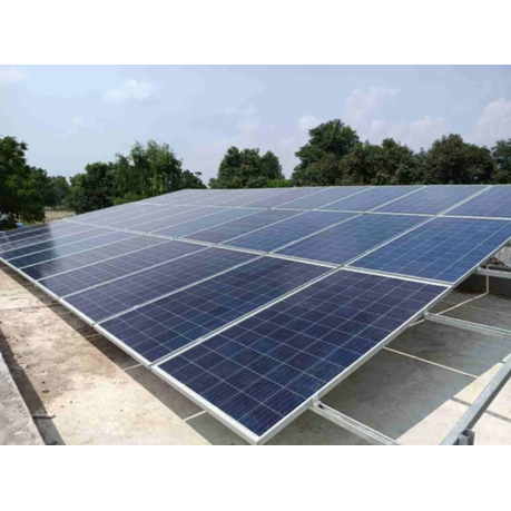 Solar panels on a roof with trees in the background
