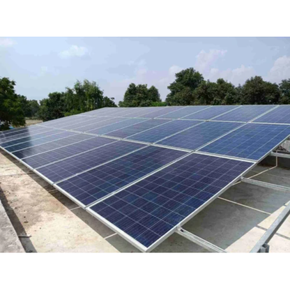 Solar panels on a roof with trees in the background
