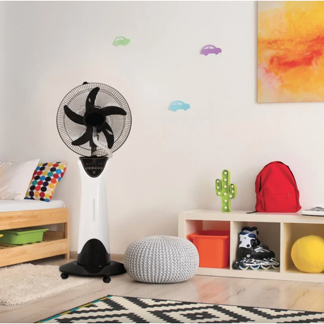 Black and white oscillating fan in a room with colorful decor and furniture.