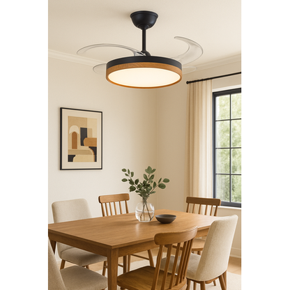 Dining room with a ceiling fan light fixture, wooden table, and chairs.