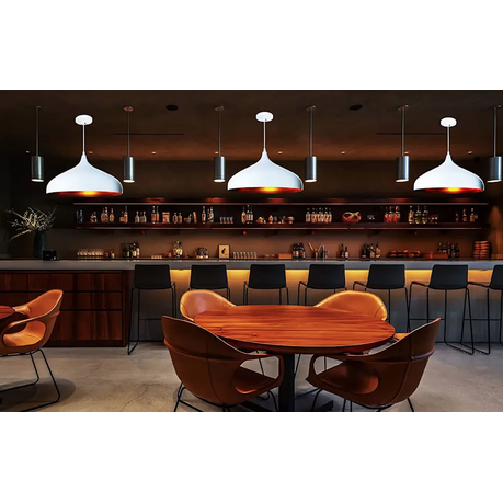 Modern bar interior with wooden table and chairs, pendant lights, and a well-stocked bar.