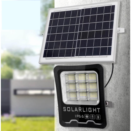 Solar light fixture with solar panel on a wall outdoors