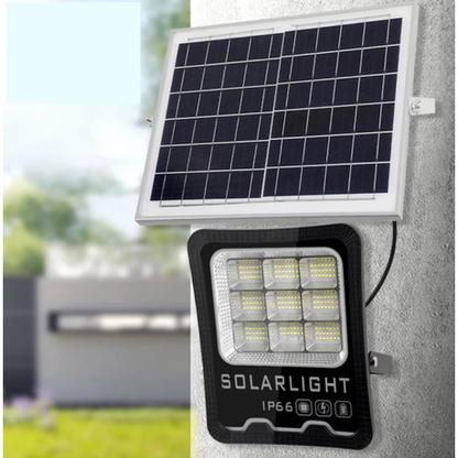 Solar light fixture with solar panel on a wall outdoors