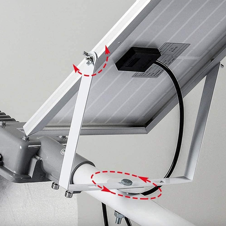 Close-up of a mechanical component with a white arm and black cable on a gray background