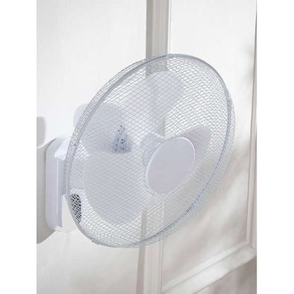 Wall-mounted fan on a white wall
